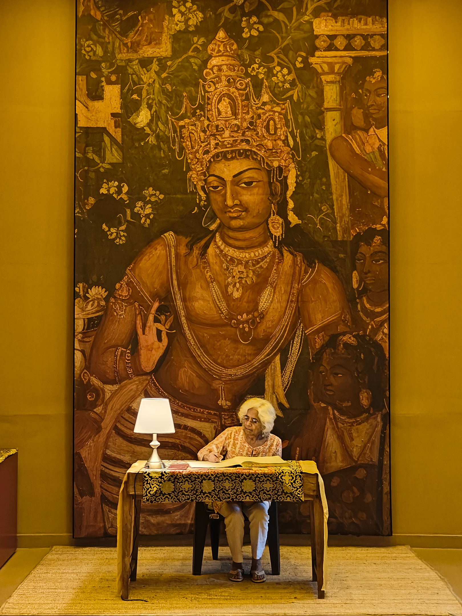 Rajni signing the visitors book at the exhbition